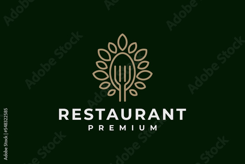 elegant restaurant logo with spoon,fork and tree