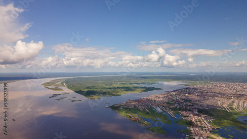 Drone aerial image of the Iquitos city on the banks of the amazing Amazon River in Peru, South America.