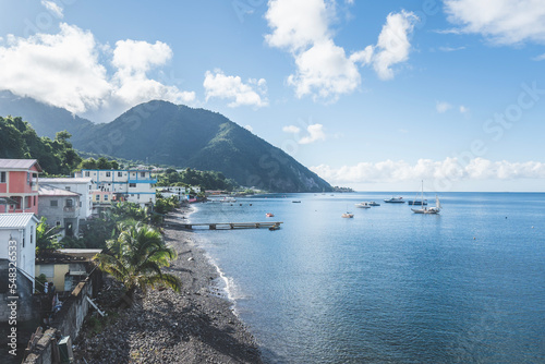 Rocky beach in Dominica, Roseau. Caribbean coastal city with access to the sea photo