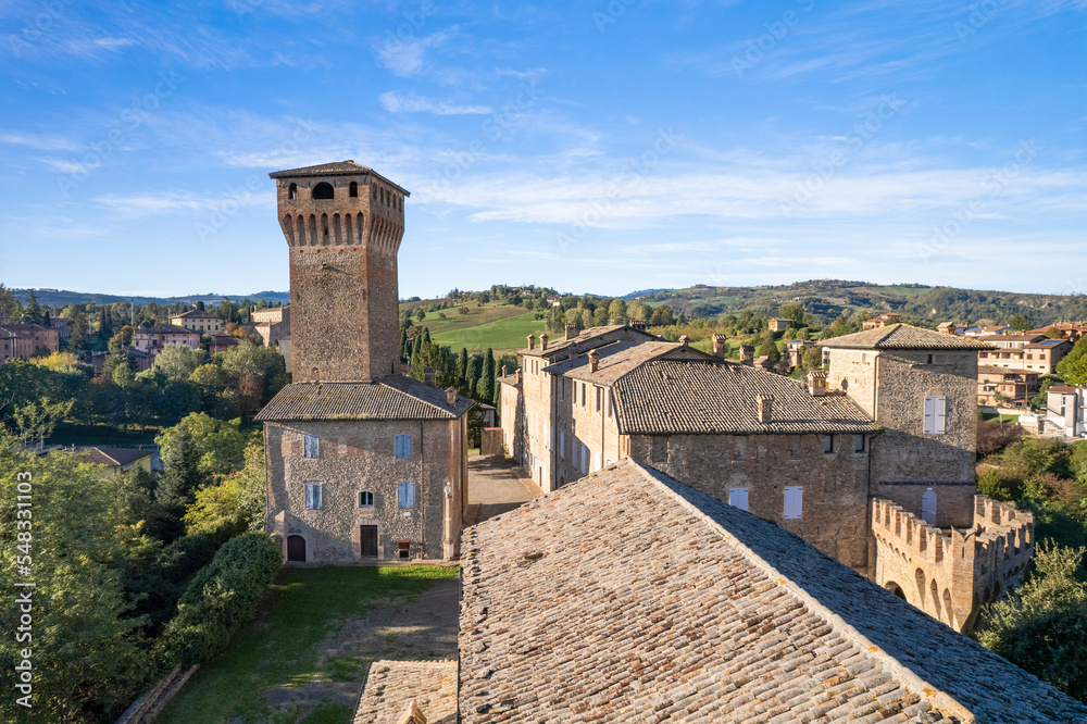 Frontal view of Tower of Levizzano Rangone medieval castle with blue sky background in Emilia Romagna region in Italy
