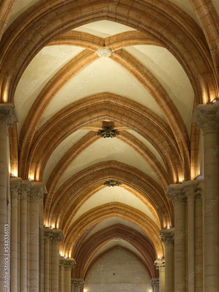 Majestic gothic vaulted ceiling with stones arches and keystones