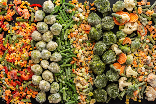 Frozen vegetable mix, frozen green beans and broccoli, corn and carrots, brussels sprouts and cauliflower, peas and bell peppers, eggplant and zucchini, top view