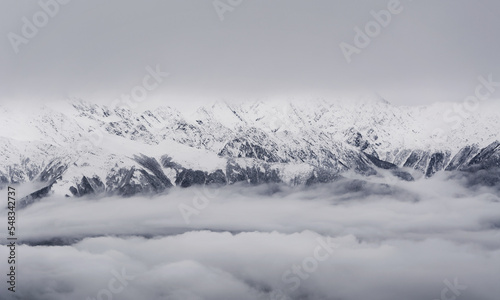 Winter in the Caucasus mountains with snow in the clouds. Sochi. Winter. Russia.