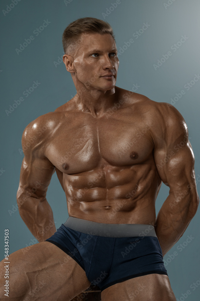 Portrait of an adult athletic man with a naked torso