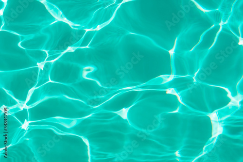 Turquoise blue surface of a swimming pool.