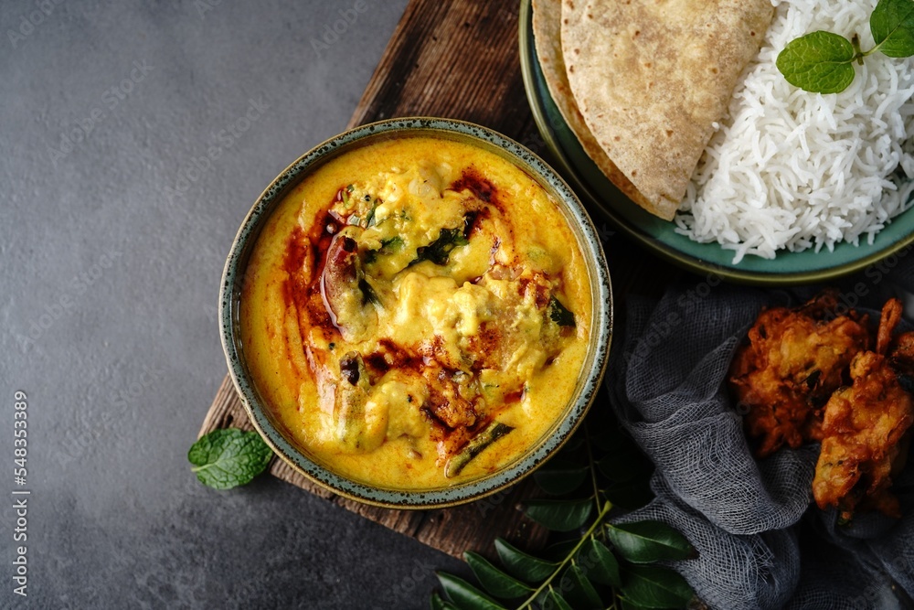 Homemade Punjabi Kadhi pakora served with rice and roti Stock Photo