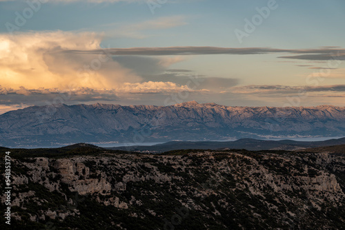 Wonderful landscape of Brac island from Vidova Gora mountain with view on distant Biokovo mountain on croatian mainland, across the sea