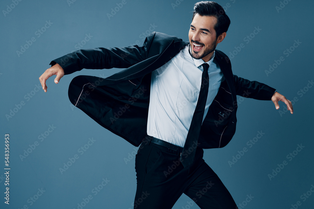 Man business happy in jacket and shirt jumping and running on blue background raised hands up smile with teeth. Successful business Man business happy in jacket and shirt jumping and running on blue background raised hands up smile with teeth. Successful business