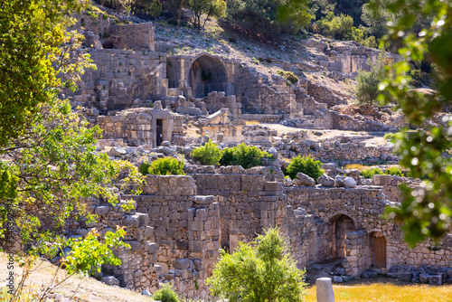 Remains of gymnasium in acnient Lycian city Arycanda. Ancient city on mountain near village of Aykiricay, Antalya, Turkey. photo