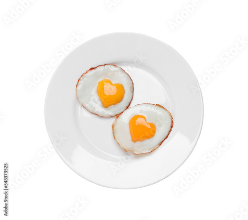 Plate with tasty fried eggs with yolks in shape of heart on white background, top view