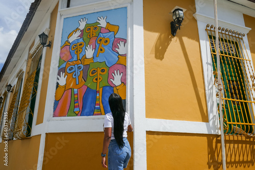 Young Woman walking through the streets of Barranquilla, Colombia photo