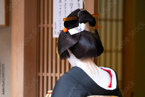 Traditional geisha out and about walking in Gion Kyoto Japan .

