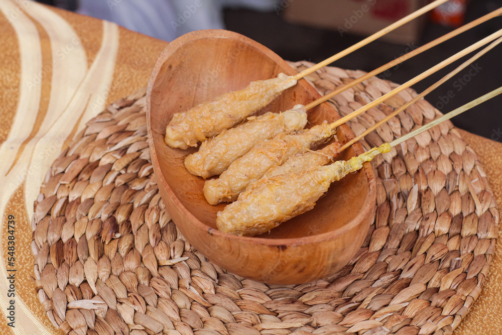 Sempol Ayam is a popular snack in the city of Malang. This practical snack is made from a mixture of chicken, tapioca flour, eggs, and various spices, then skewered on a skewer and then fried.