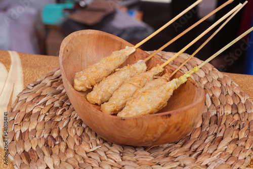 Sempol Ayam is a popular snack in the city of Malang. This practical snack is made from a mixture of chicken, tapioca flour, eggs, and various spices, then skewered on a skewer and then fried. photo