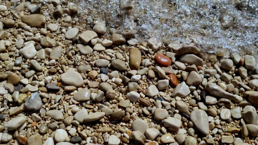 Pebble looks clear at Zlatni Rat Beach on the island of Brac, Croatia Pebble looks clear at Zlatni Rat Beach on the island of Brac, Croatia