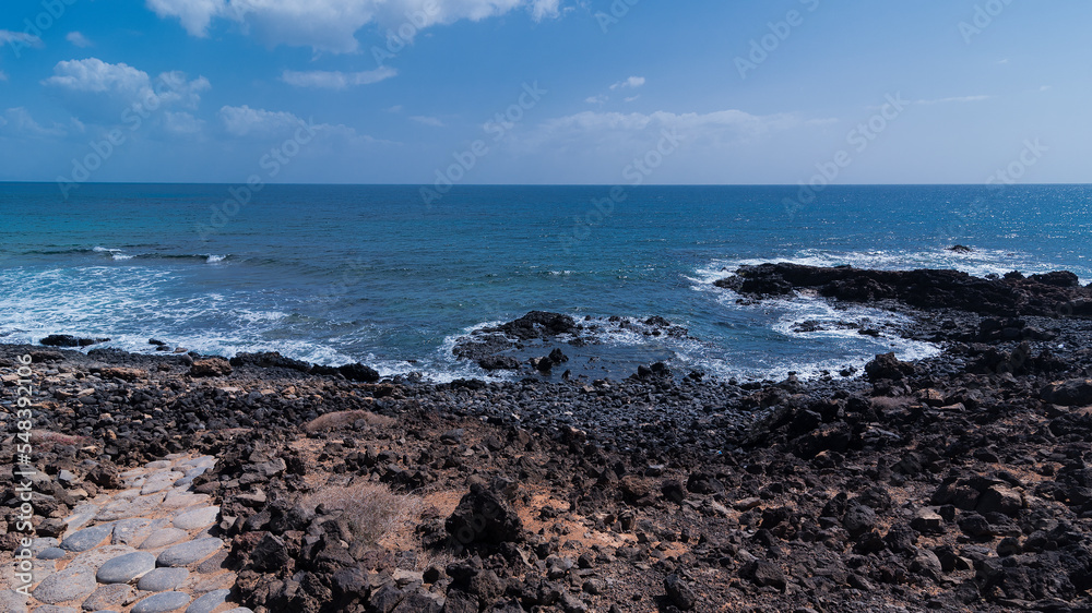 Atlantic ocean volcanic coastline, Lobos Island, Spain Atlantic ocean volcanic coastline, Lobos Island, Spain