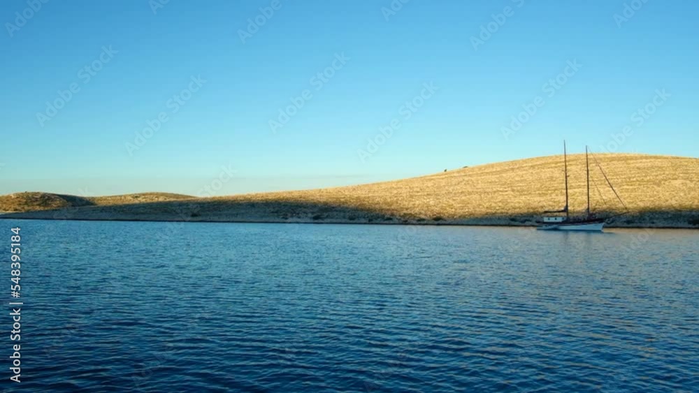 Calm, peaceful ocean with a horizon, hills on a beautiful day Calm, peaceful ocean with a horizon, hills on a beautiful day