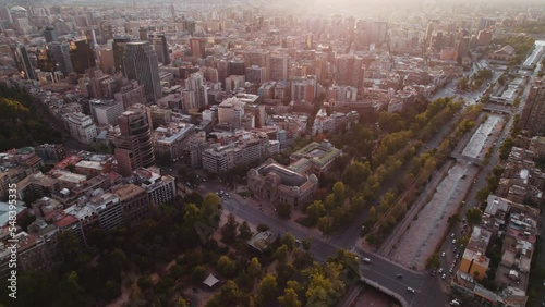 Skylines Of Santiago City Capital In Chile During Sunset. Aerial Tilt up photo
