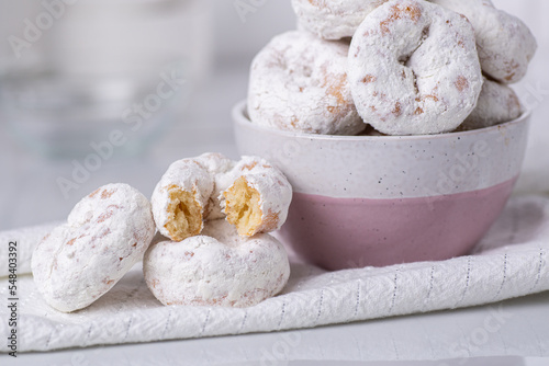 Close up of powdered sugar mini donuts