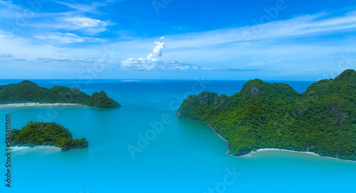 Fototapeta Naklejka Na Ścianę i Meble -  Aerial view of  tropical with seashore as the island in a coral reef ,blue and turquoise sea Amazing nature landscape with blue lagoon