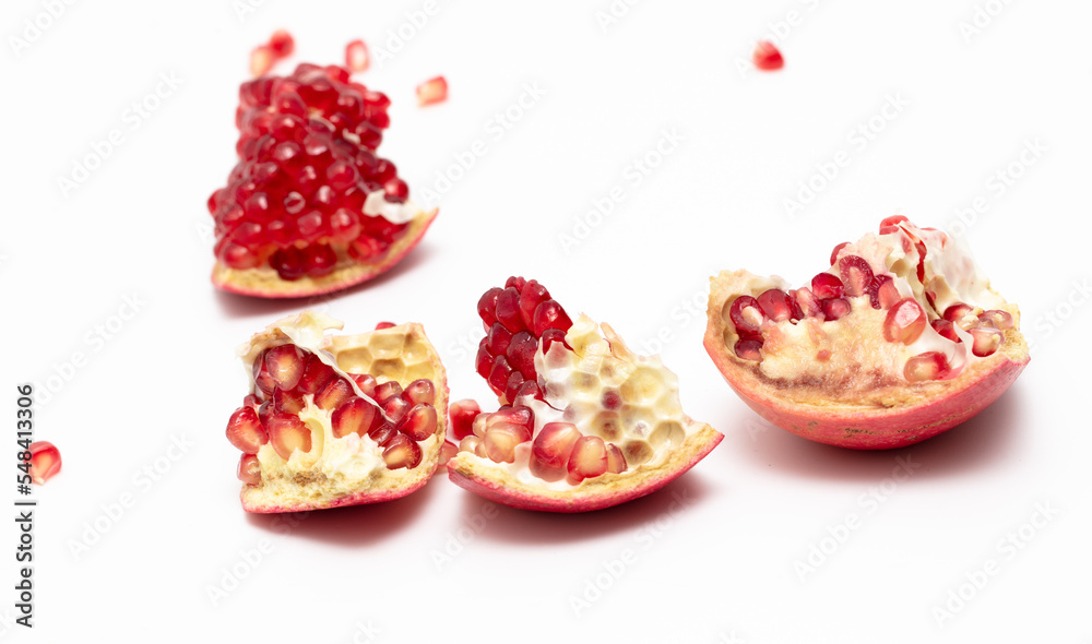 Juicy pomegranate berries isolated on white background. Juicy pomegranate berries isolated on white background.