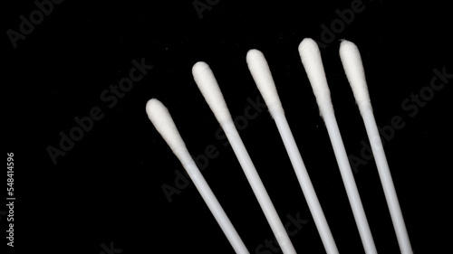 Isolated a couple pieces of cotton bud with black background.