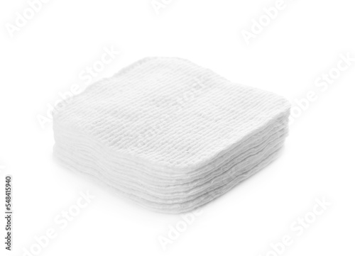 Stack of cotton pads on white background