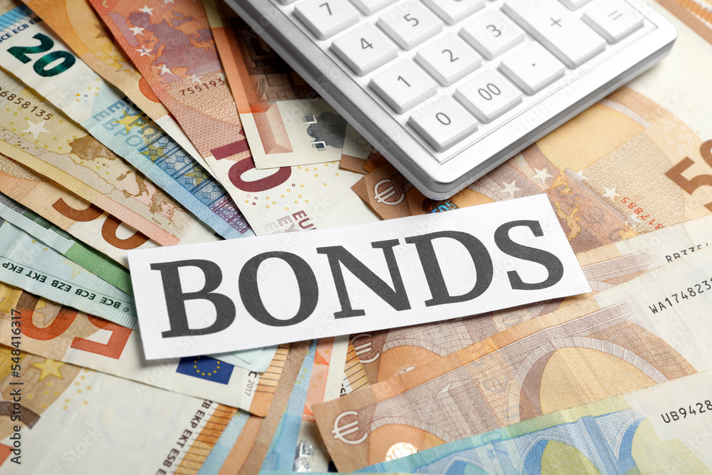 Many euro banknotes and paper with word Bonds as background Many euro banknotes and paper with word Bonds as background