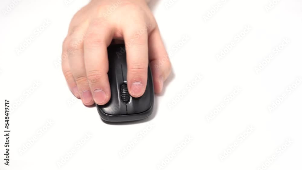 A man's hand uses a wireless mouse A man's hand uses a wireless mouse