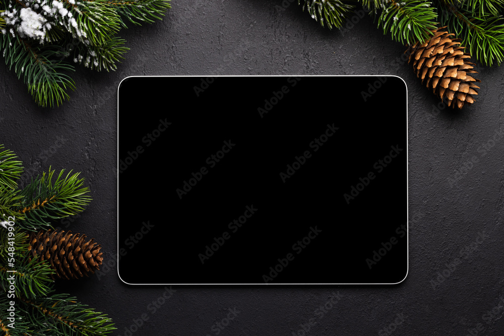 Tablet with blank screen and Christmas decor - obrazy, fototapety, plakaty 