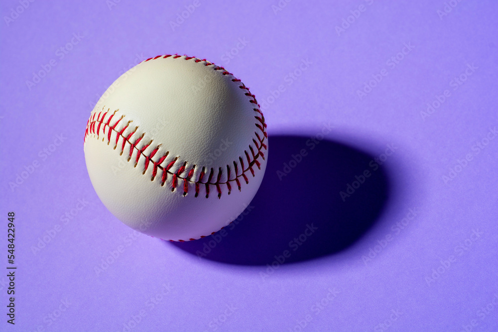 baseball ball on violet background close up with shadow baseball ball on violet background close up with shadow