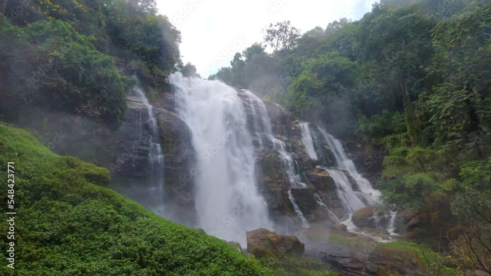 Dynamic view of stunning waterfall in lush jungle with water hitting lens