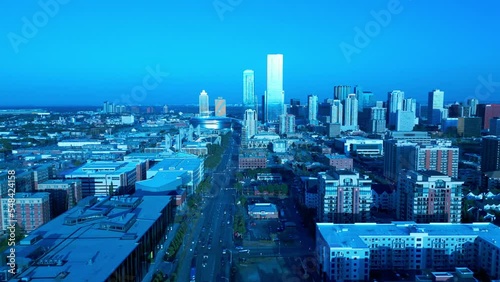 Edmonton downtown flyover main downtown 104th avenue NW towards hockey arena McEwan University Norquest College capital city residential retail district studios apartments condos twilight 4k 3-3 photo