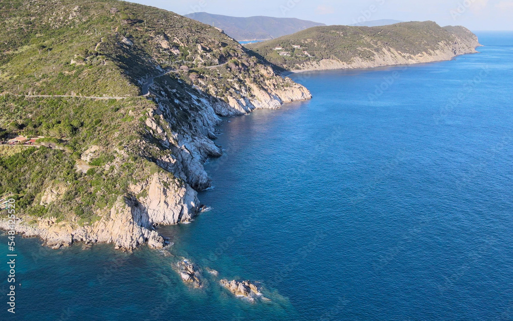 Aerial view of Elba Island. Cavoli Beach and Southern Coastline in summer season. Drone viewpoint. Slow motion.