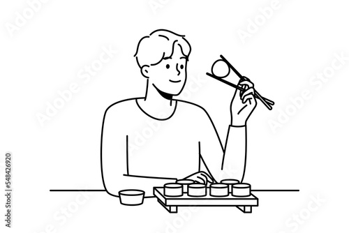 Smiling man sit at table in restaurant eating sushi with chopsticks. Happy guy enjoy traditional Asian food in cafe or bar. Vector illustration. 