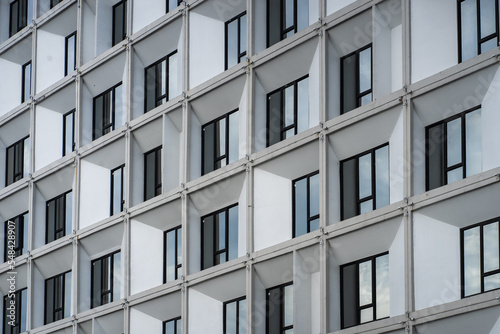 Abstract fragment of modern architecture, wall made of glass and concrete