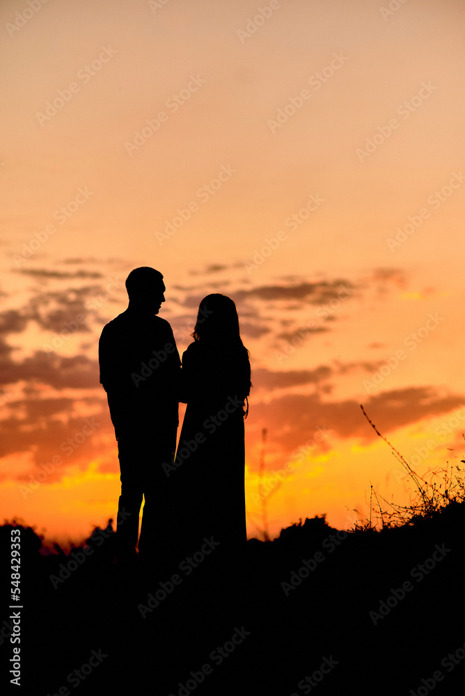 Silhouette photo of a couple at sunset