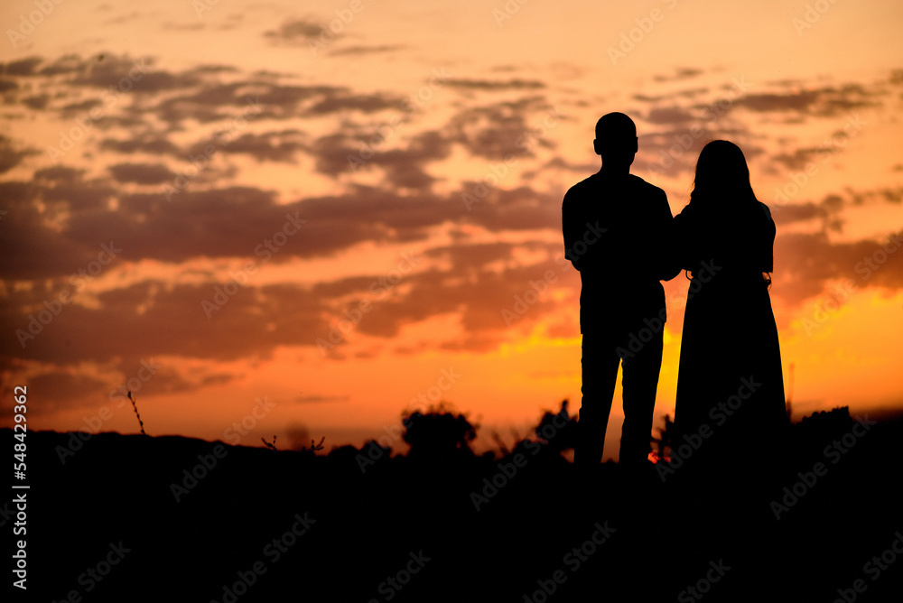 Silhouette photo of a couple at sunset