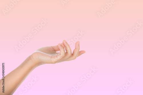 Beauty and Health theme: beautiful elegant female hand show gesture on an isolated Pink background.