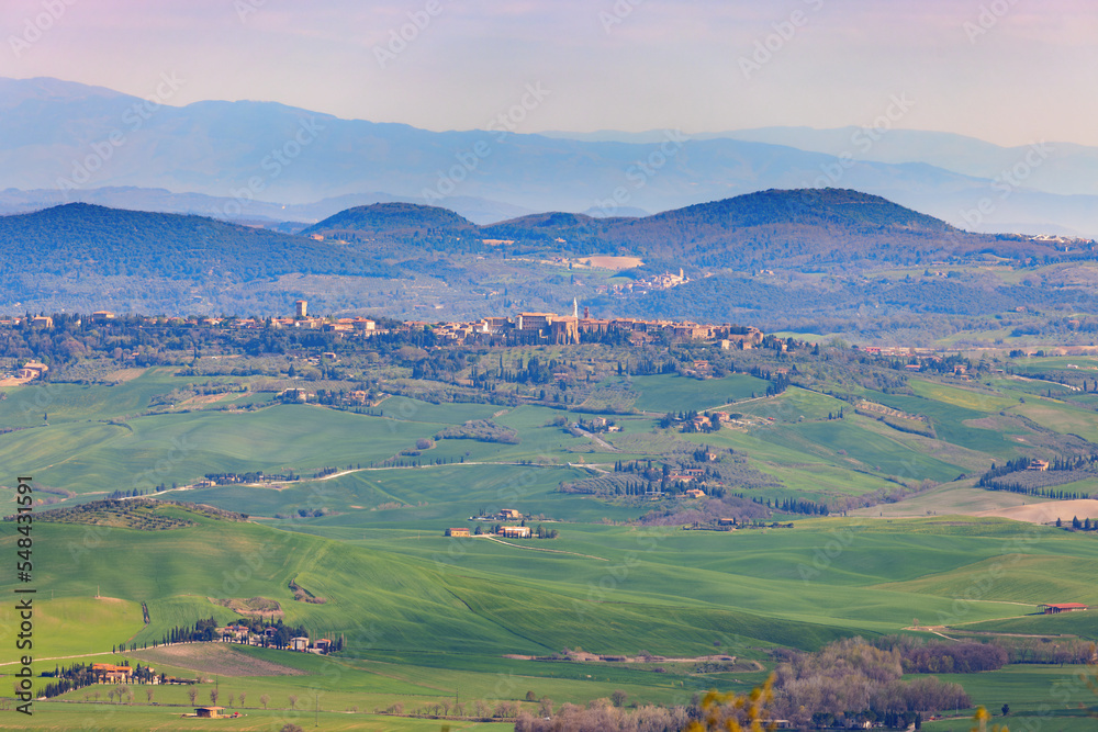 View towards Pienza on a hill in the Val d'Orcia in Tuscany, Italy.