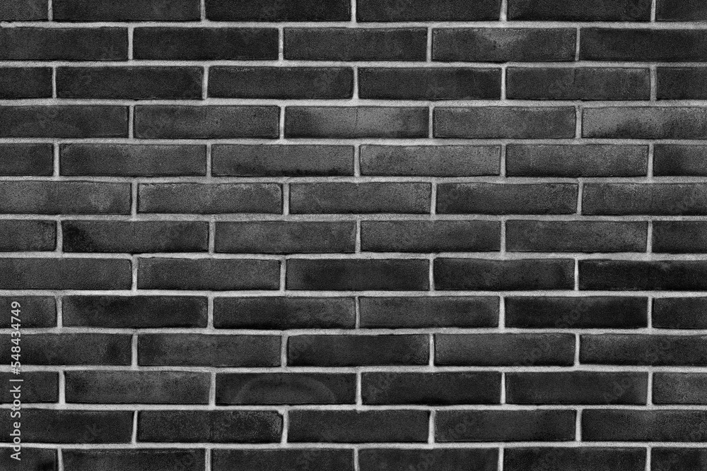 Black exposed brick wall background texture without plaster concept