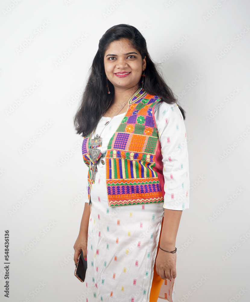 Portrait of Young indian woman isolated on white background smiling confidently . Portrait of Young indian woman isolated on white background smiling confidently .