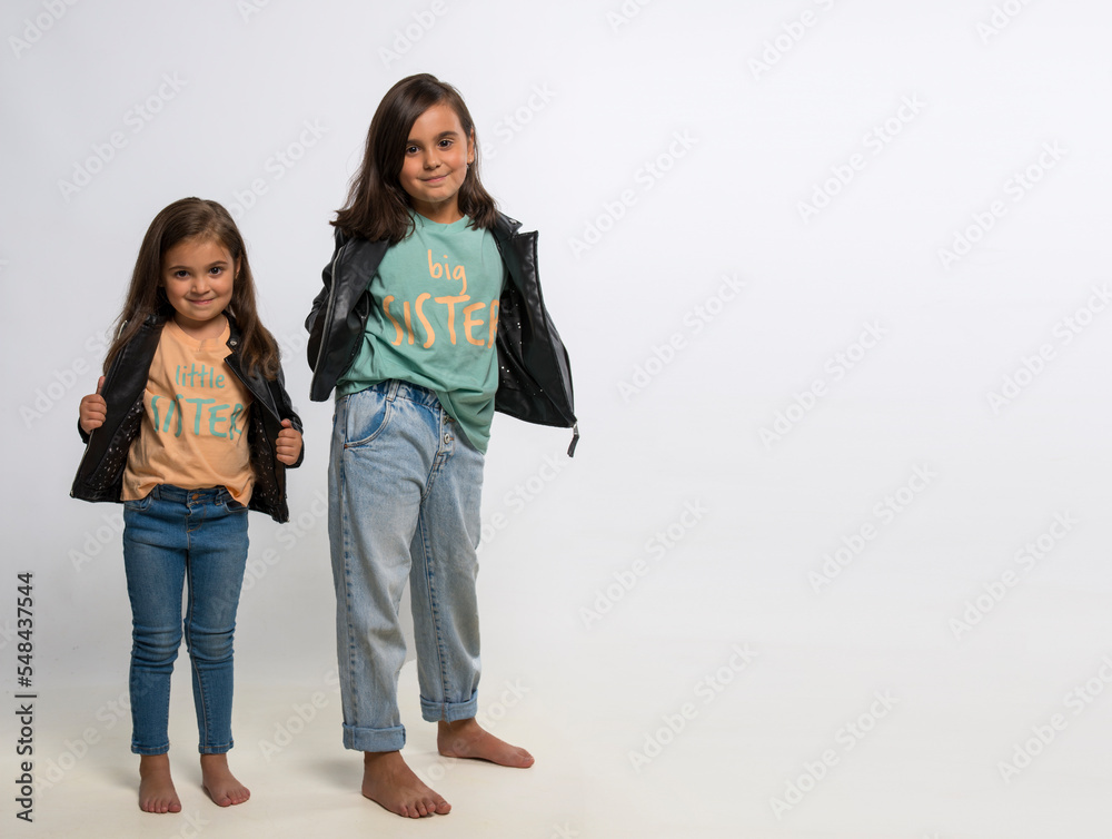 Happy cute sisters on white background, copy space Happy cute sisters on white background, copy space