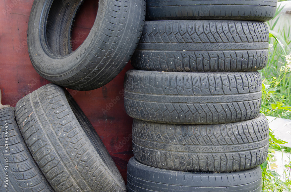 old tires folded, lots of old tires for cars
