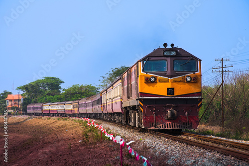 Passenger train by diesel locomotive on the railway.
