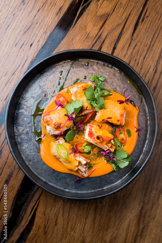 king crab with vegetables in sauce