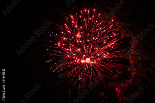 Red fireworks in the night sky