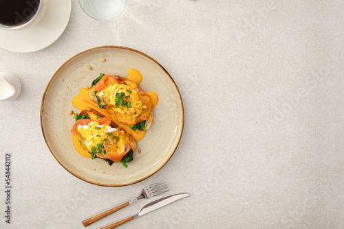 Photos Portion of eggs benedict toast with salmon and herbs breakfast