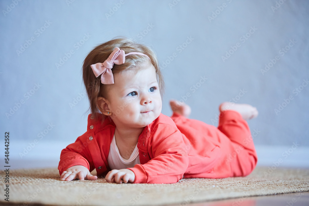 Naklejka premium A small newborn baby girl. The concept of childhood