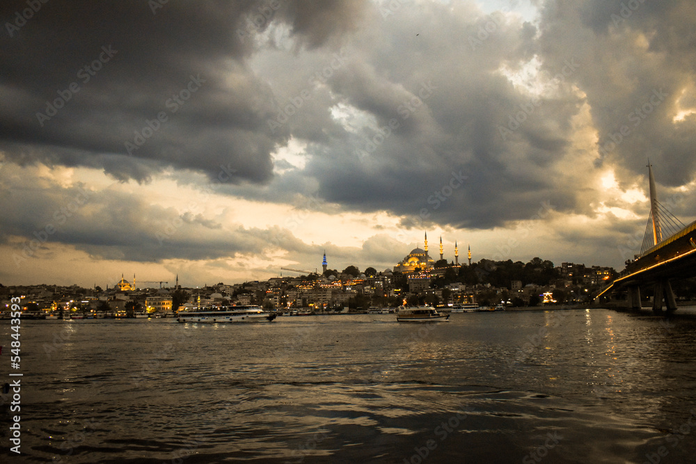 Bosporus Strait with mosque and bridge at sunset